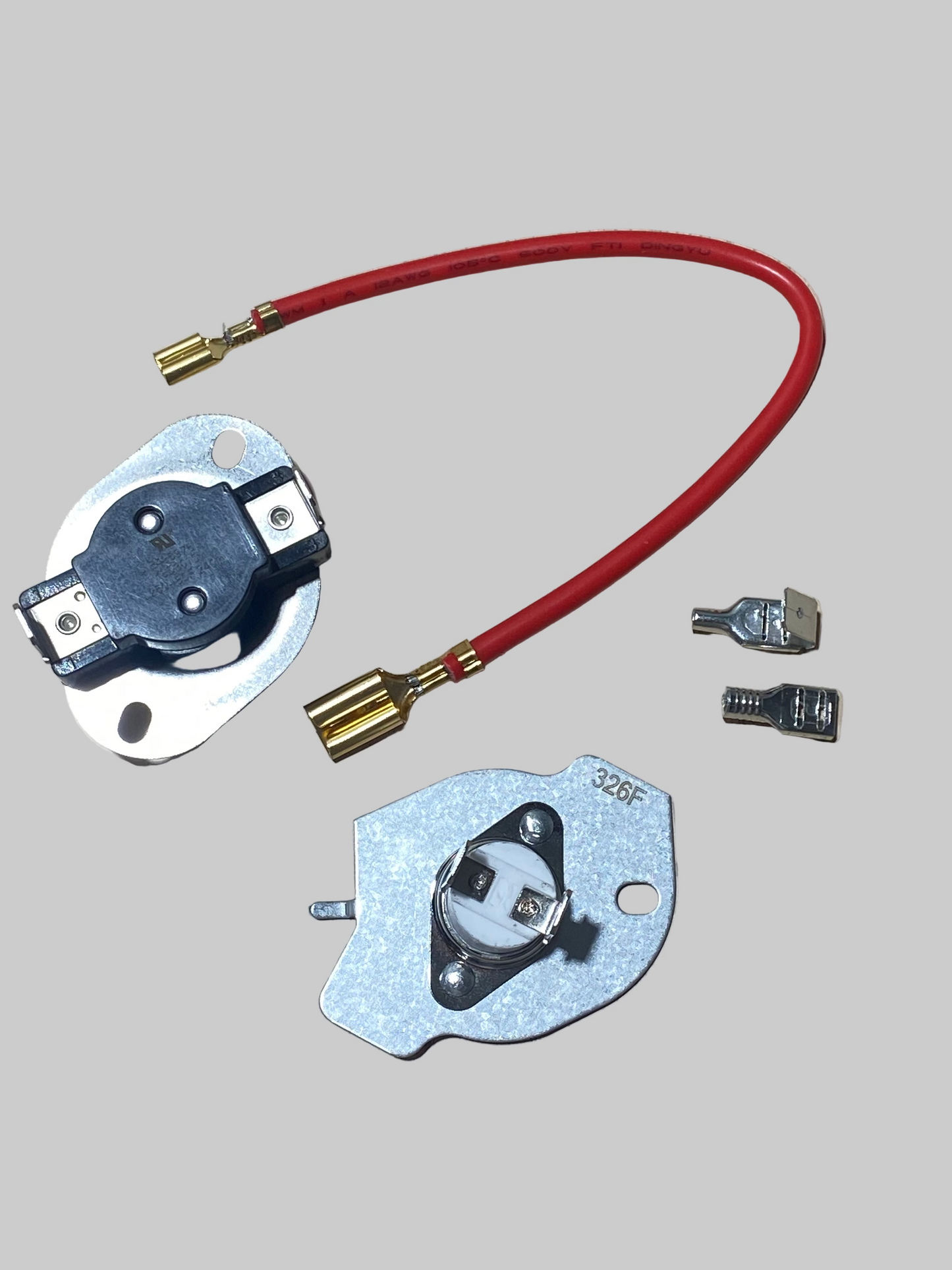 Electrical components including a red wire and metal connectors on a wooden surface